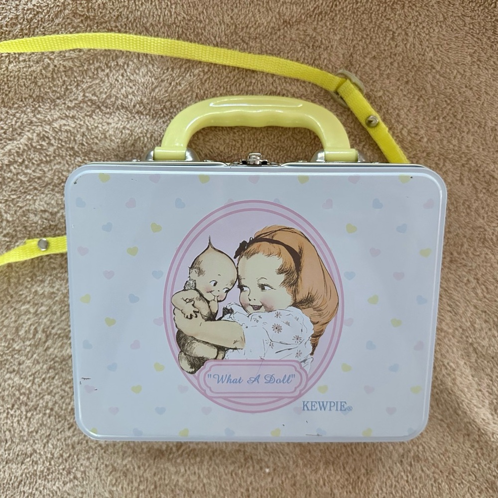 Vintage “What A Doll” lunchbox with baby inside